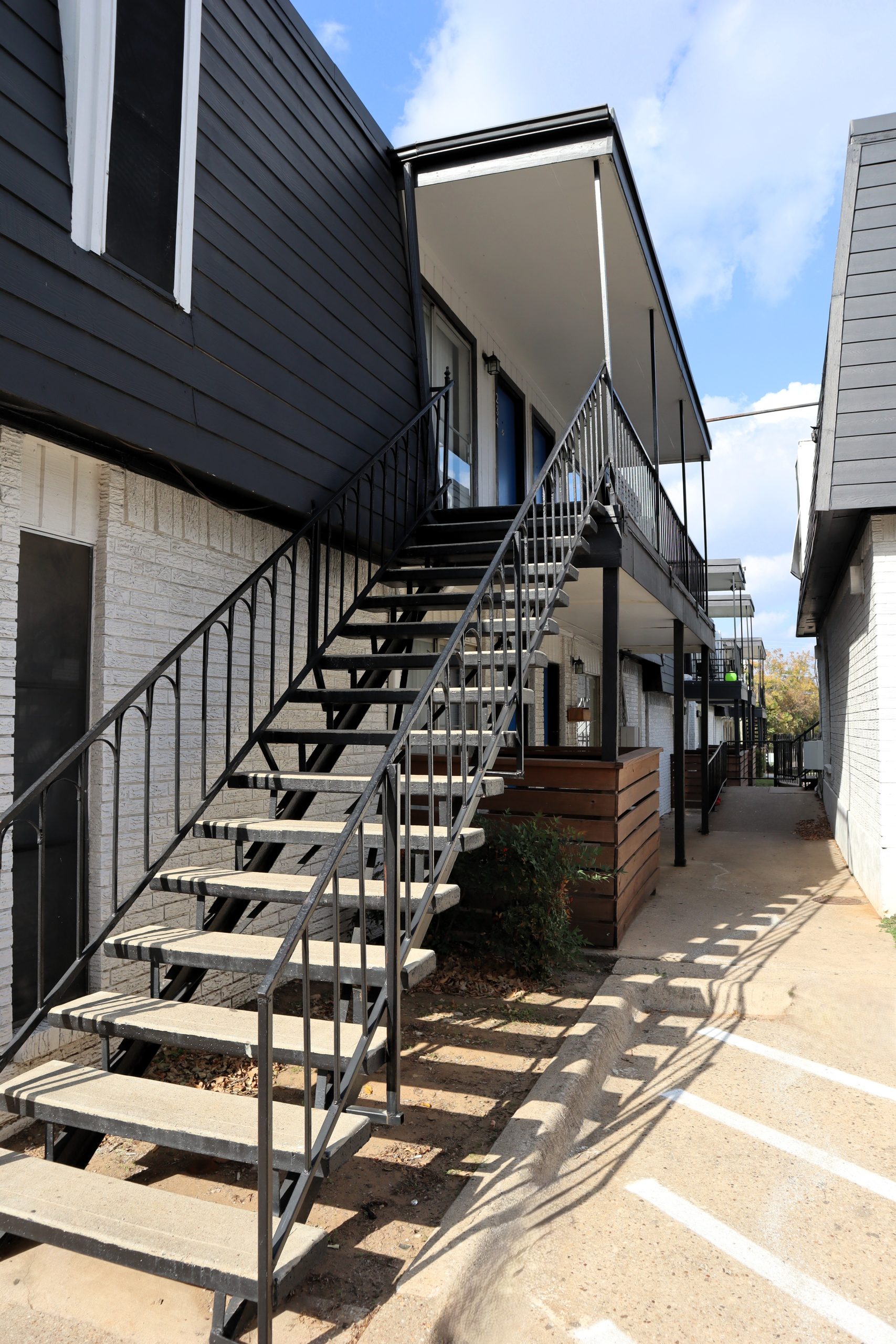 a row of stairs leading up to a balcony